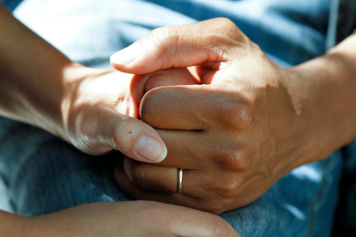 Therapist's hands working on a forearm