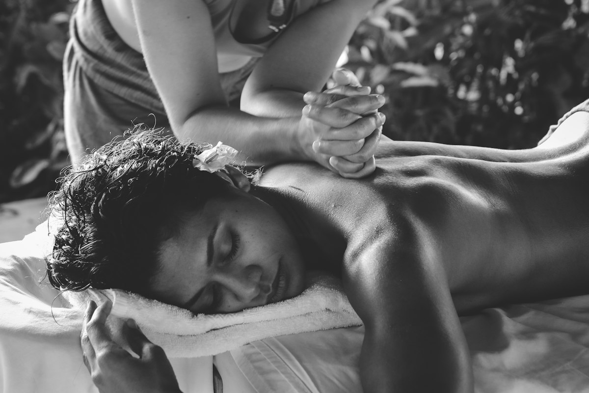 Massage therapist working on a client's back