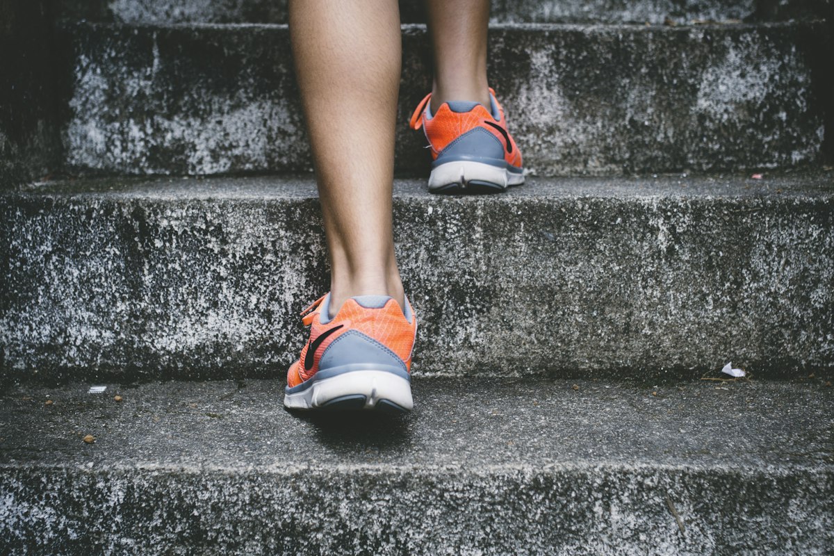 A runner stretching before an event